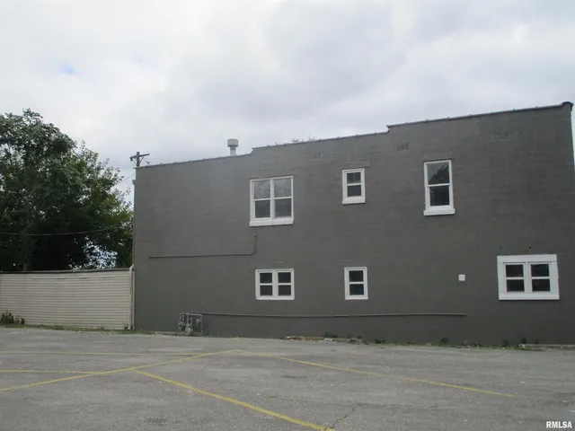 a front view of a house with garage
