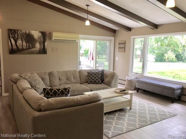 29700 Drake Road Farmington, MI 48331 - Photo 16 of 40 Family room with Vaulted Ceiling and Pendant Lighting