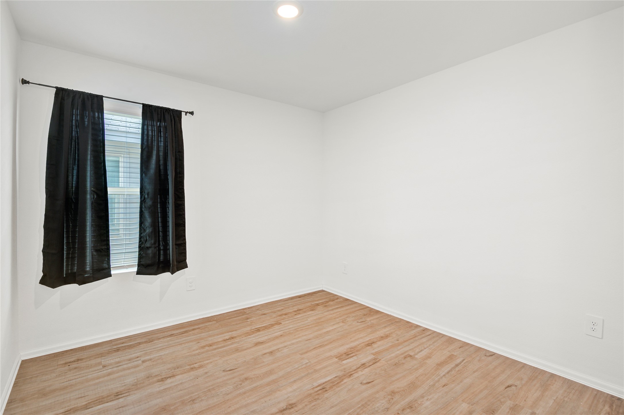 24126 Maple Turn Lane Hockley, TX 77447 - Photo 18 of 25 an empty room with wooden floor and closet