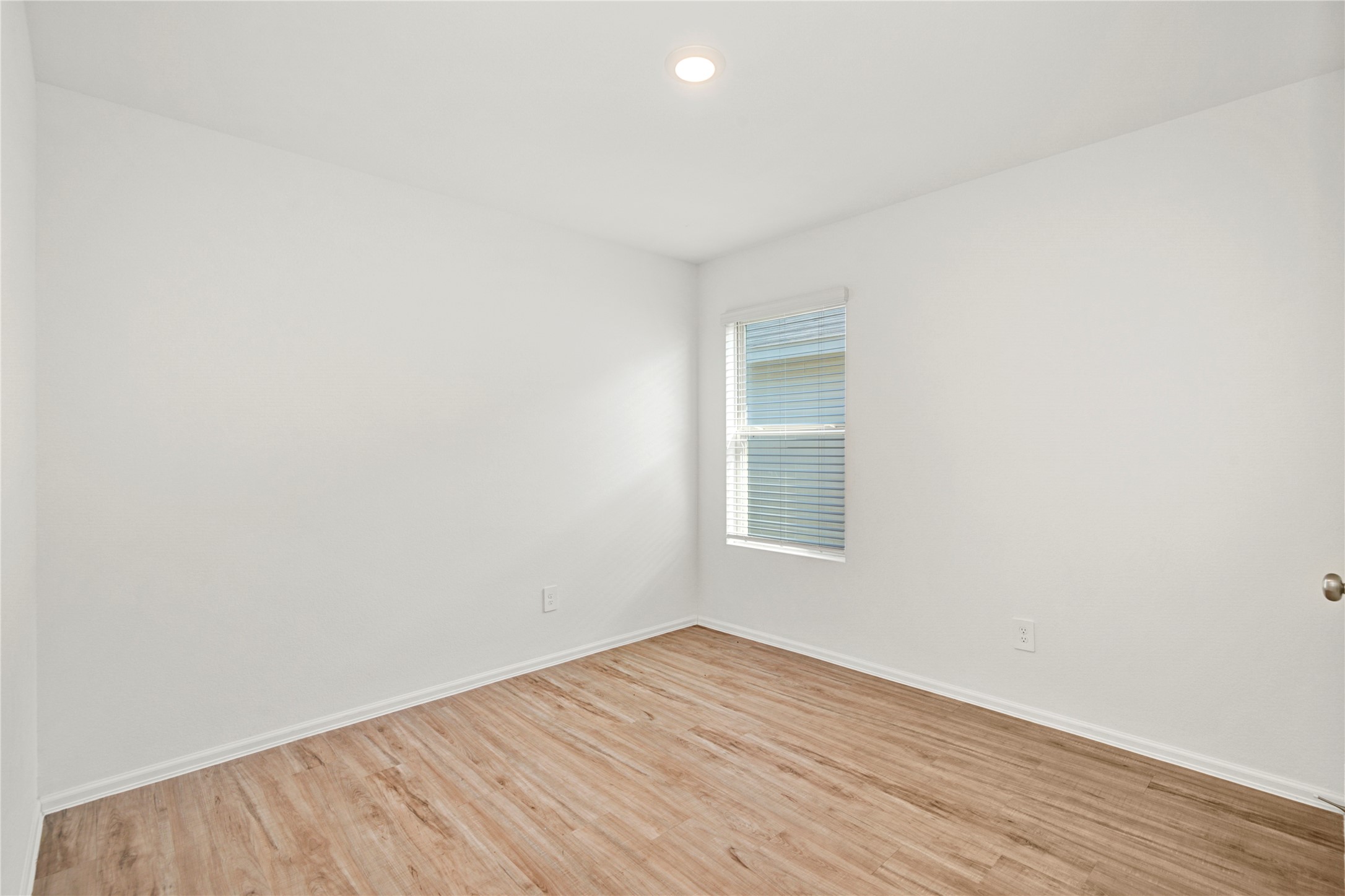 24126 Maple Turn Lane Hockley, TX 77447 - Photo 20 of 25 an empty room with wooden floor and windows