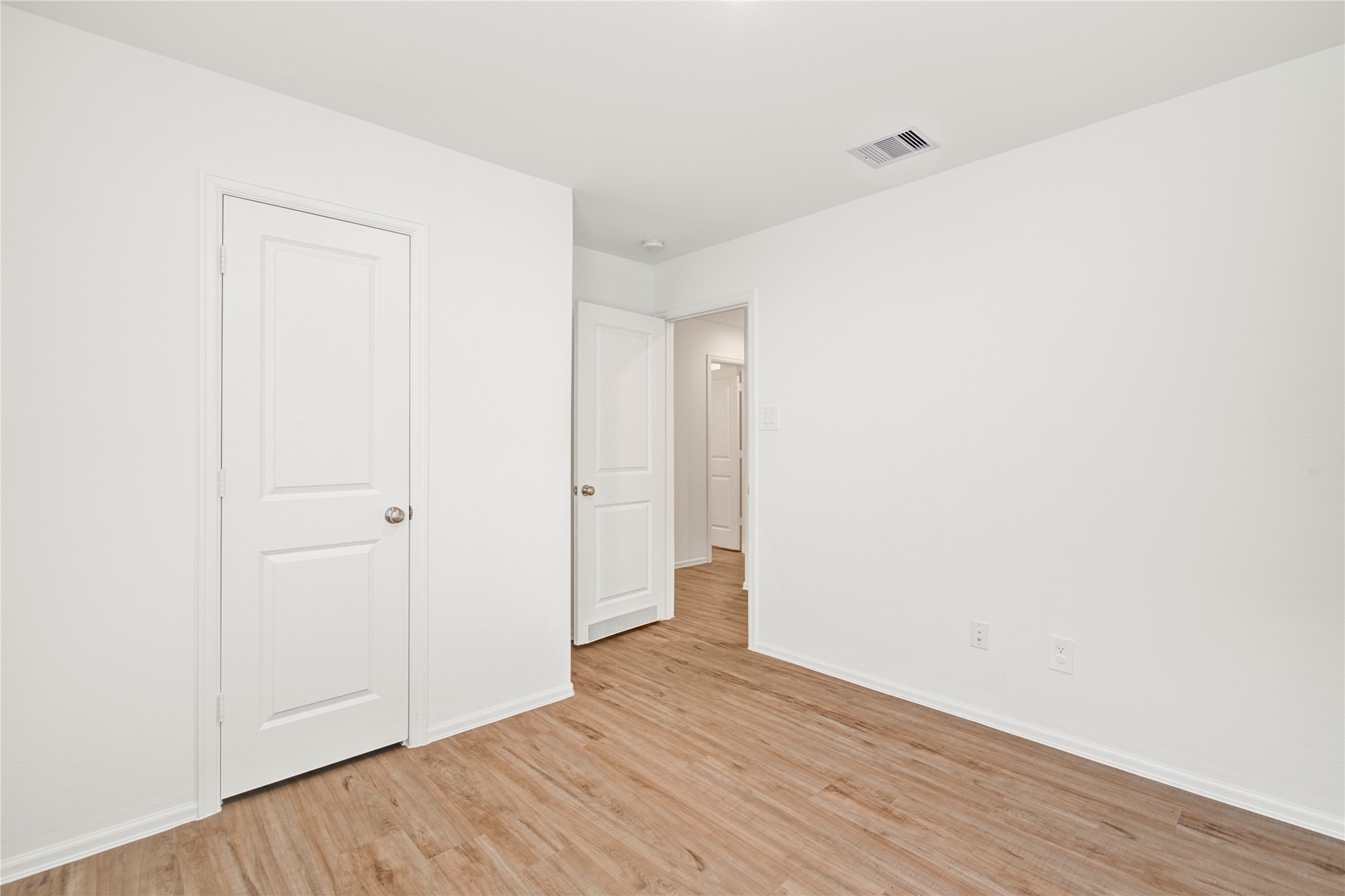 24126 Maple Turn Lane Hockley, TX 77447 - Photo 21 of 25 a view of an empty room with wooden floor
