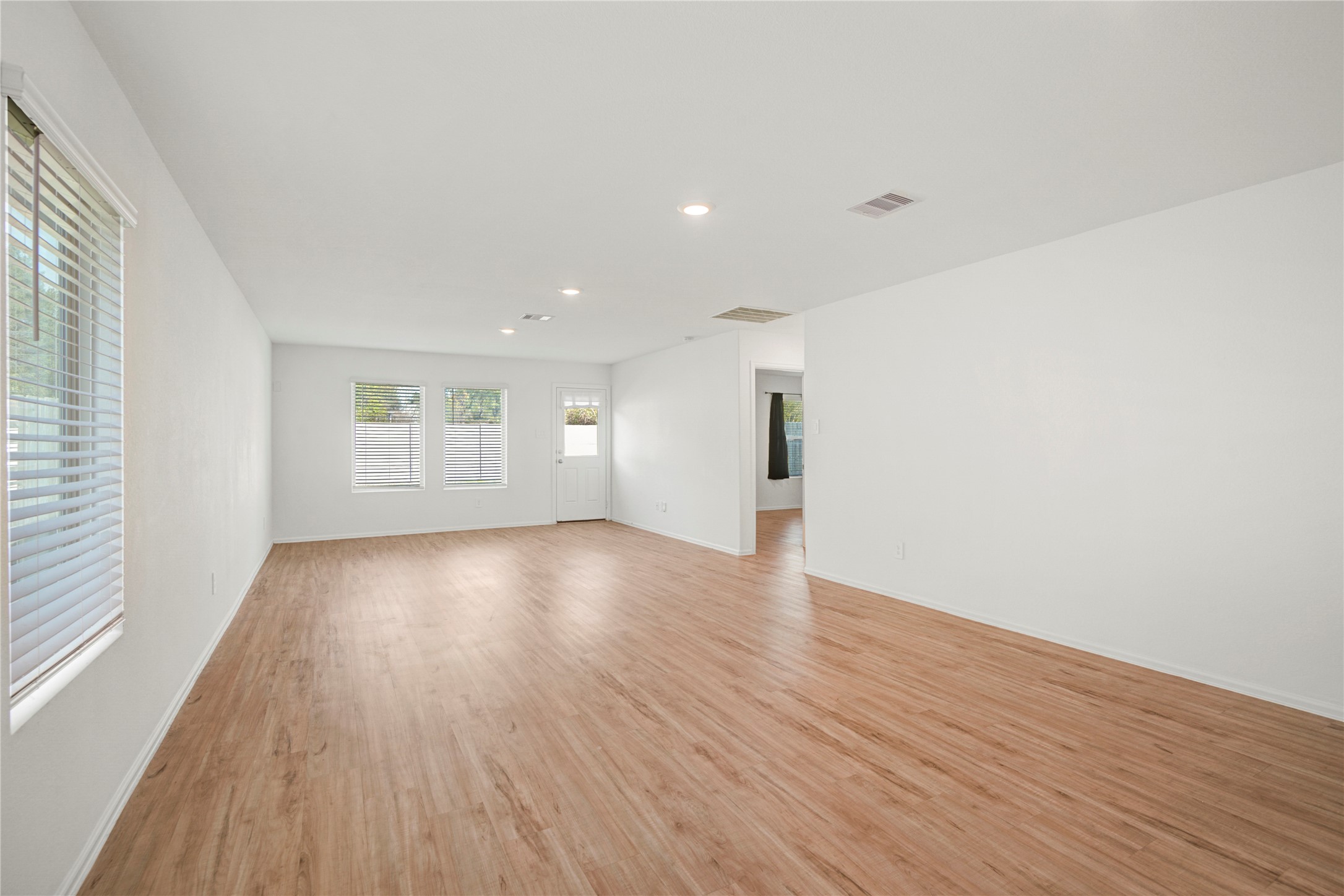 24126 Maple Turn Lane Hockley, TX 77447 - Photo 8 of 25 wooden floor in an empty room with a window