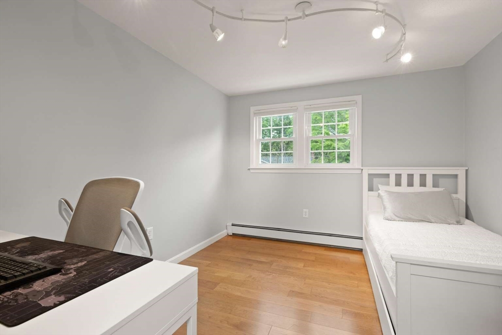 18 Winsor Road Billerica, MA 01821 - Photo 16 of 28 a bedroom with a bed and a chair