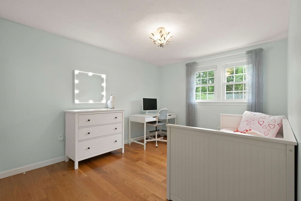 18 Winsor Road Billerica, MA 01821 - Photo 17 of 28 a bedroom with a bed and a desk