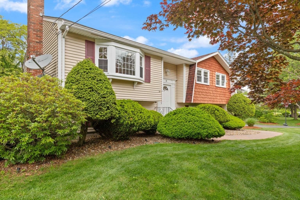 18 Winsor Road Billerica, MA 01821 - Photo 4 of 28 a front view of a house with a garden