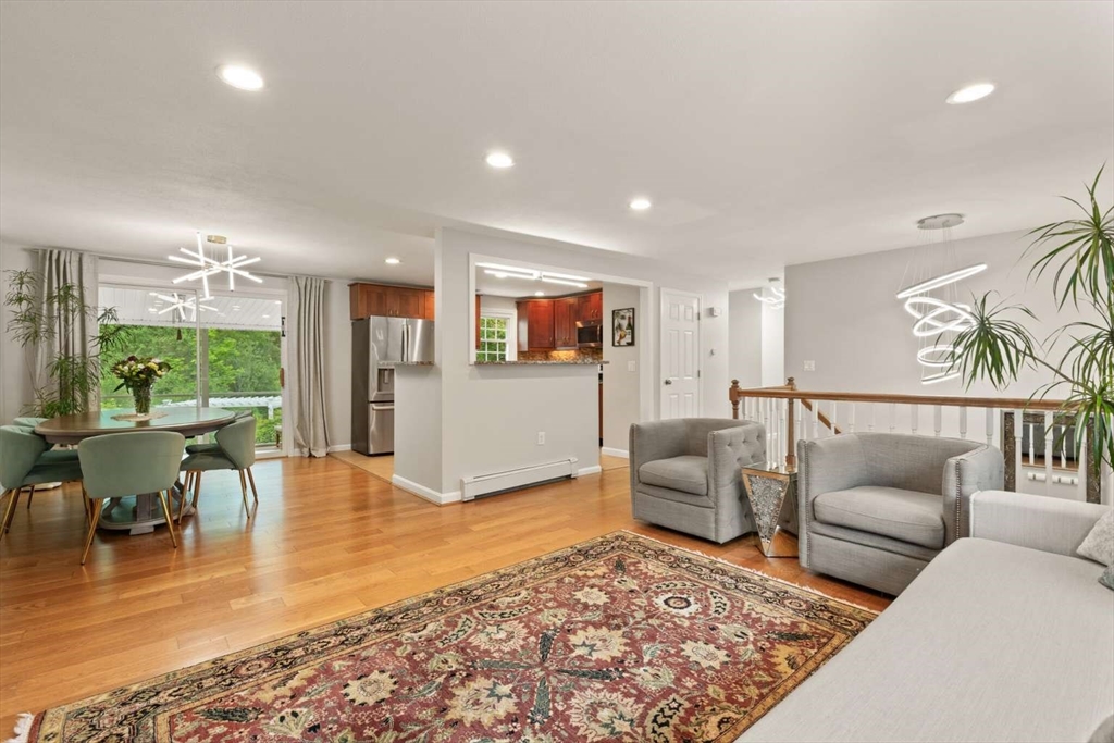18 Winsor Road Billerica, MA 01821 - Photo 6 of 28 a living room with furniture and a wooden floor