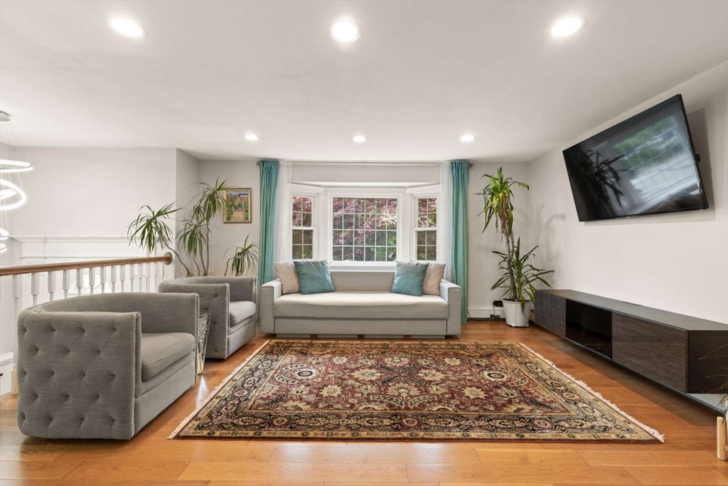 18 Winsor Road Billerica, MA 01821 - Photo 8 of 28 a living room with furniture rug and a flat screen tv