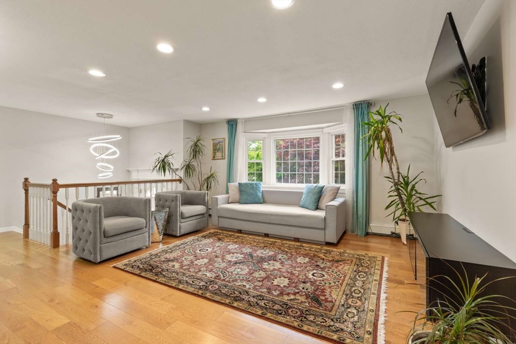 18 Winsor Road Billerica, MA 01821 - Photo 9 of 28 a living room with furniture and a flat screen tv