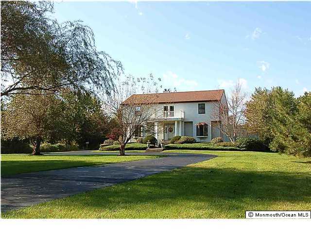 563 Seven Bridges Road Little Silver, NJ 07739 - Photo 1 of 3 a front view of a house with a yard
