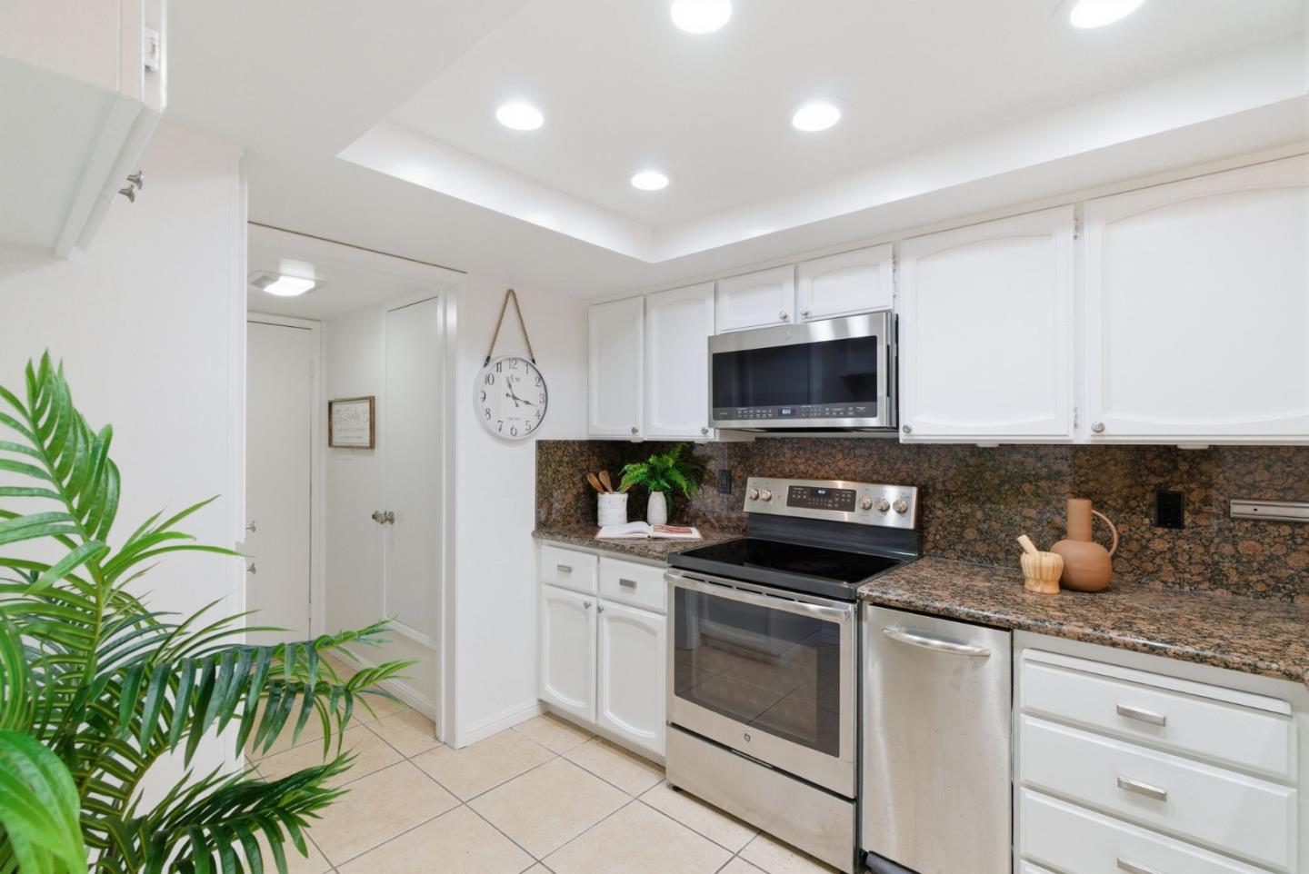 1144 Cherryview Lane San Jose, CA 95118 - Photo 14 of 77 a kitchen with granite countertop a stove a sink and a microwave