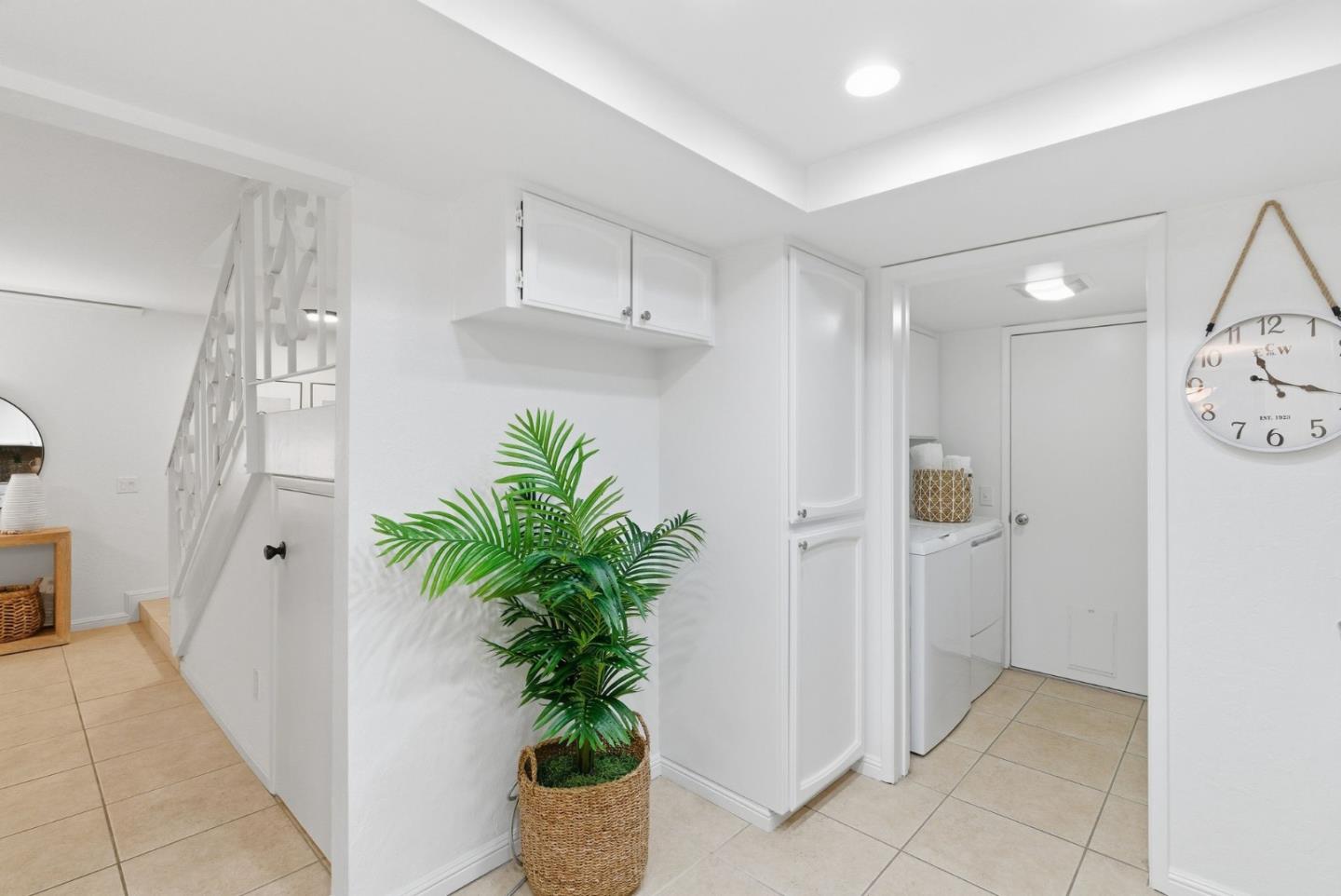 1144 Cherryview Lane San Jose, CA 95118 - Photo 16 of 77 a room with white cabinets and potted plant