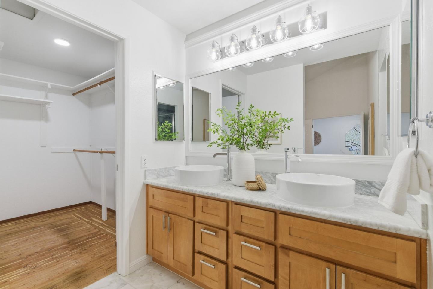 1144 Cherryview Lane San Jose, CA 95118 - Photo 24 of 77 a bathroom with a sink and a mirror