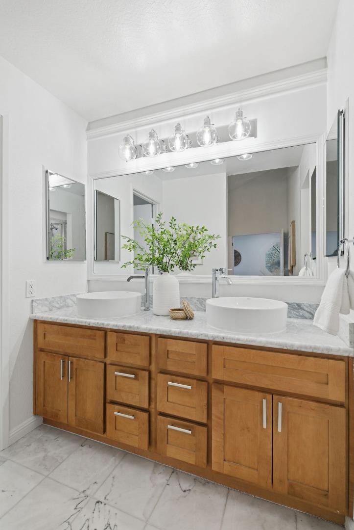 1144 Cherryview Lane San Jose, CA 95118 - Photo 25 of 77 a bathroom with a granite countertop sink and a mirror