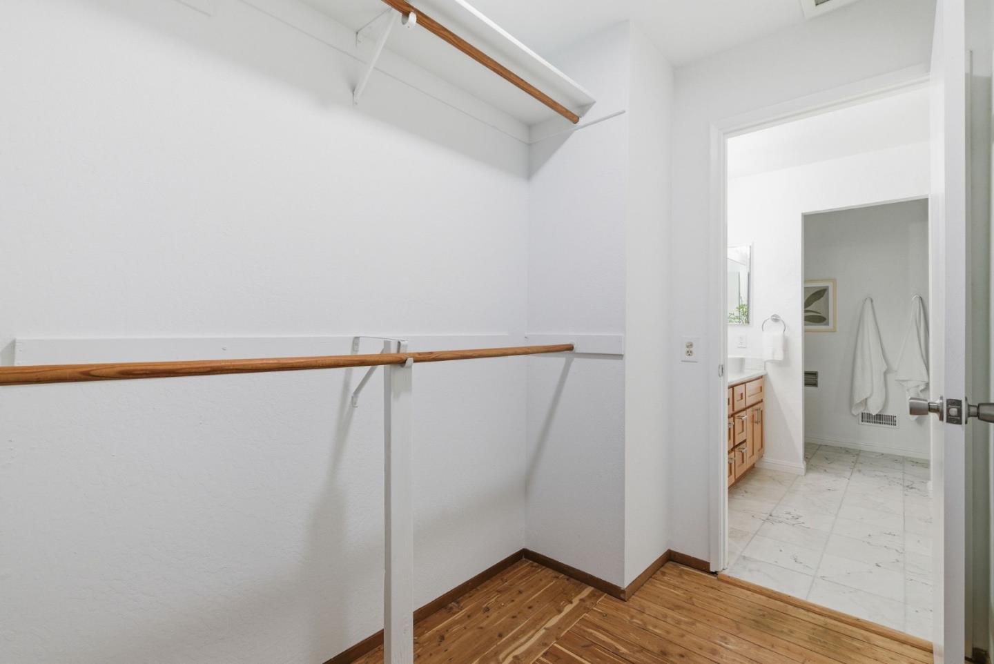 1144 Cherryview Lane San Jose, CA 95118 - Photo 26 of 77 a view of walk in closet with wooden floor