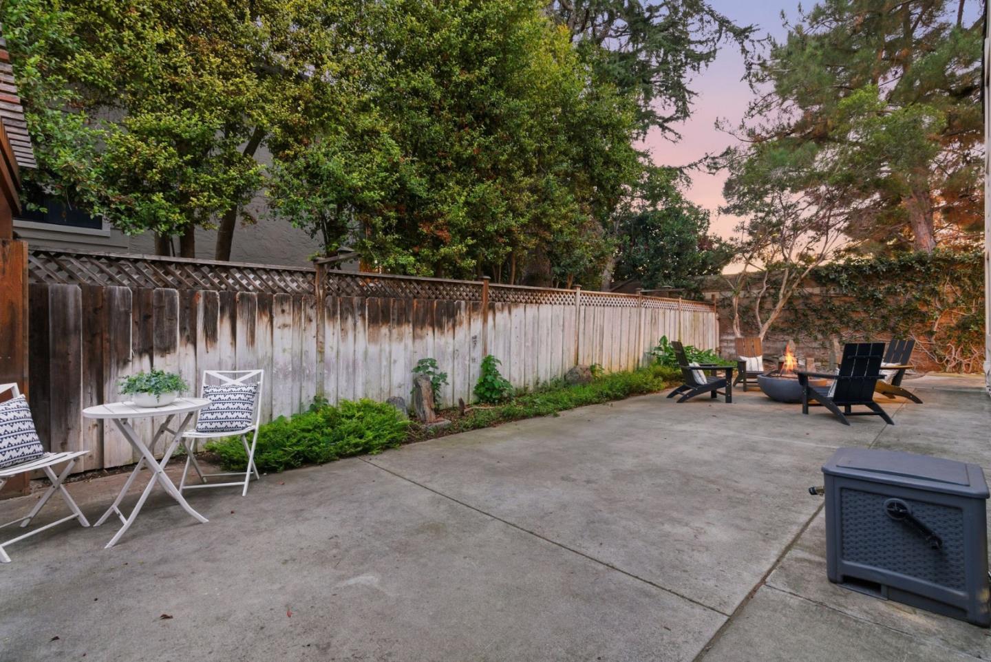 1144 Cherryview Lane San Jose, CA 95118 - Photo 47 of 77 a backyard of a house with chairs and a fire pit