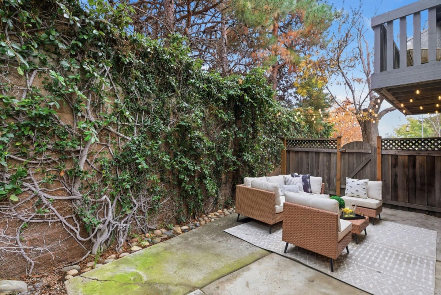 1144 Cherryview Lane San Jose, CA 95118 - Photo 57 of 77 a wooden bench sitting in backside of a house with large trees