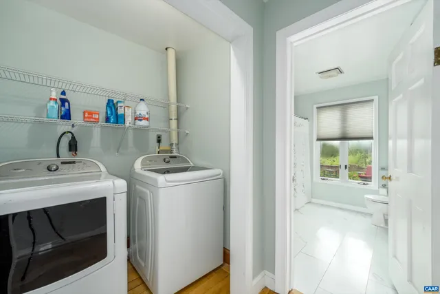 a kitchen with a sink cabinets and appliances