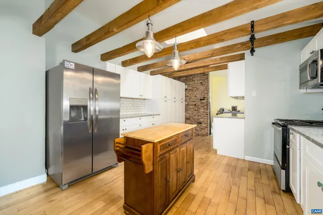 a kitchen with a refrigerator a sink and dishwasher