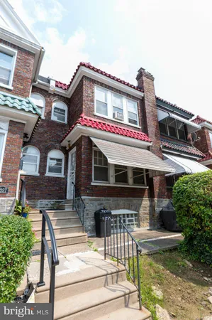 a front view of a house with swimming pool
