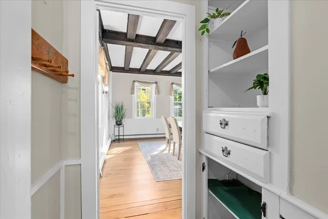 a view of a dining room with furniture and wooden floor
