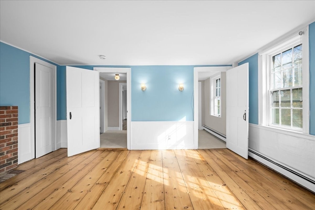 19 Gilmore Road Southborough, MA 01772 - Photo 23 of 42 a view of empty room with wooden floor and fan