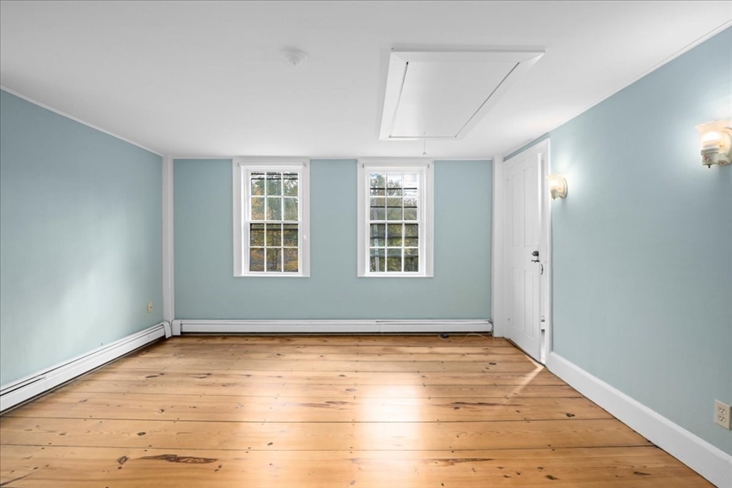 19 Gilmore Road Southborough, MA 01772 - Photo 25 of 42 an empty room with wooden floor and windows