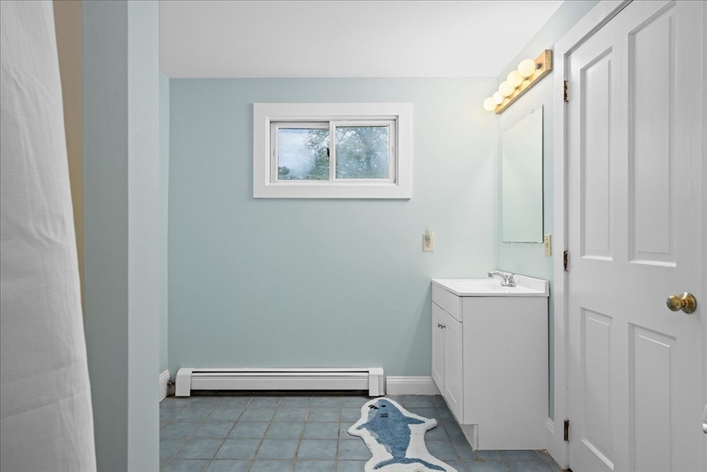 19 Gilmore Road Southborough, MA 01772 - Photo 27 of 42 a bathroom with a sink a toilet and shower