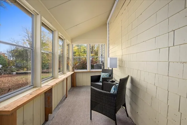 a view of a hallway with stairs