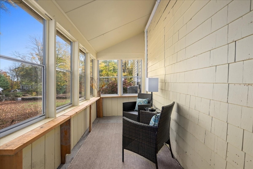 19 Gilmore Road Southborough, MA 01772 - Photo 28 of 42 a view of a dining room with furniture large windows and wooden floor