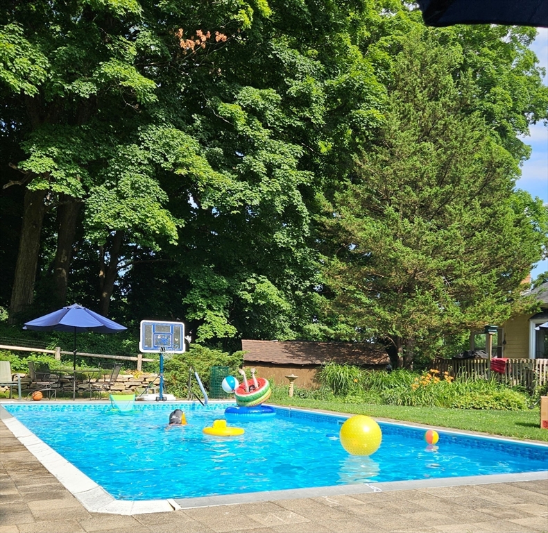 19 Gilmore Road Southborough, MA 01772 - Photo 32 of 42 a view of a backyard with swimming pool