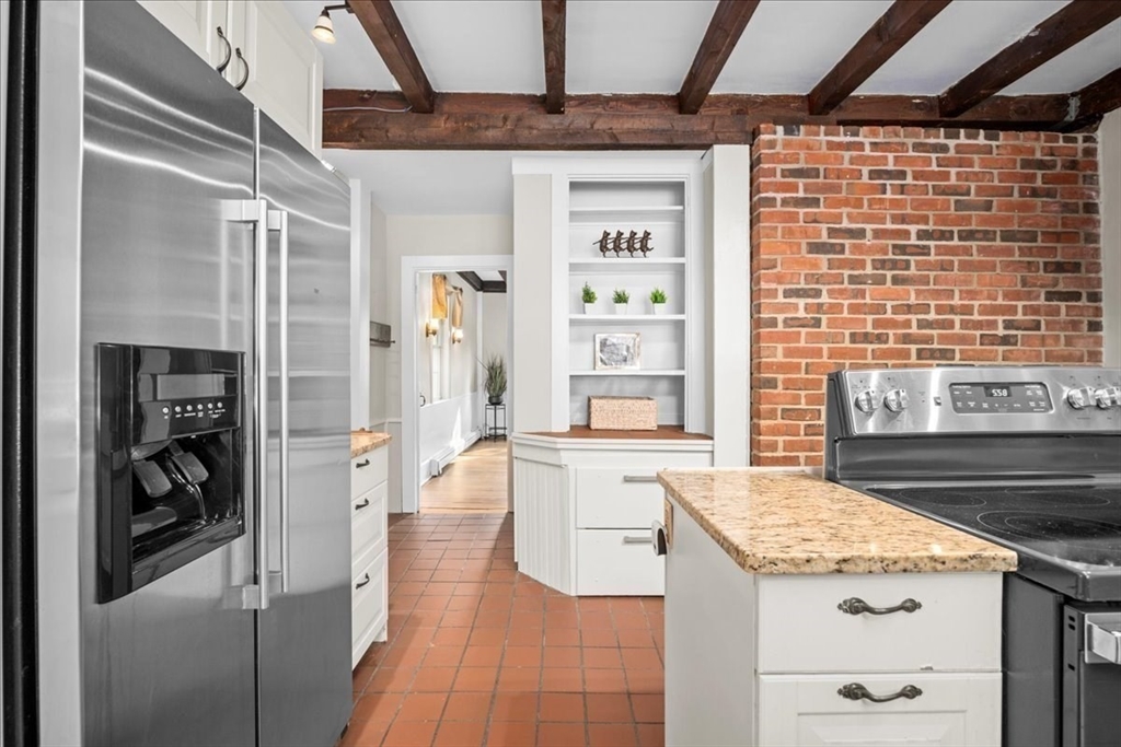19 Gilmore Road Southborough, MA 01772 - Photo 8 of 42 a kitchen with granite countertop stainless steel appliances and wooden cabinets