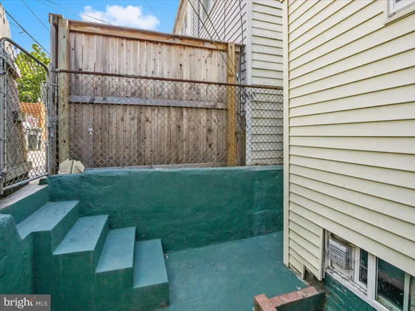 a view of backyard with small cabin