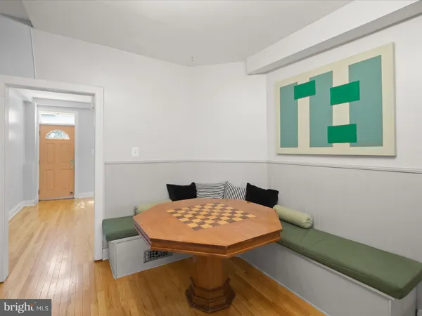 a view of a room that has a table and a chair