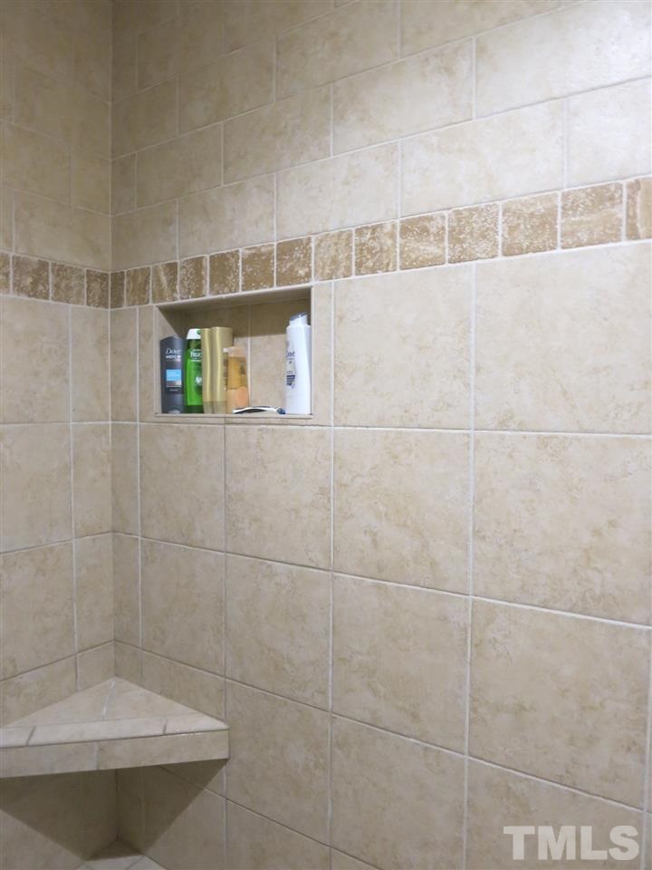 6408 Wynbrook Way Raleigh, NC 27612 - Photo 16 of 25 a bathroom with a bathtub