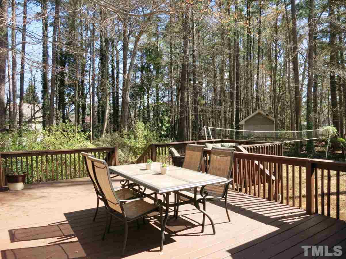 6408 Wynbrook Way Raleigh, NC 27612 - Photo 20 of 25 a view of a chairs and table on the deck