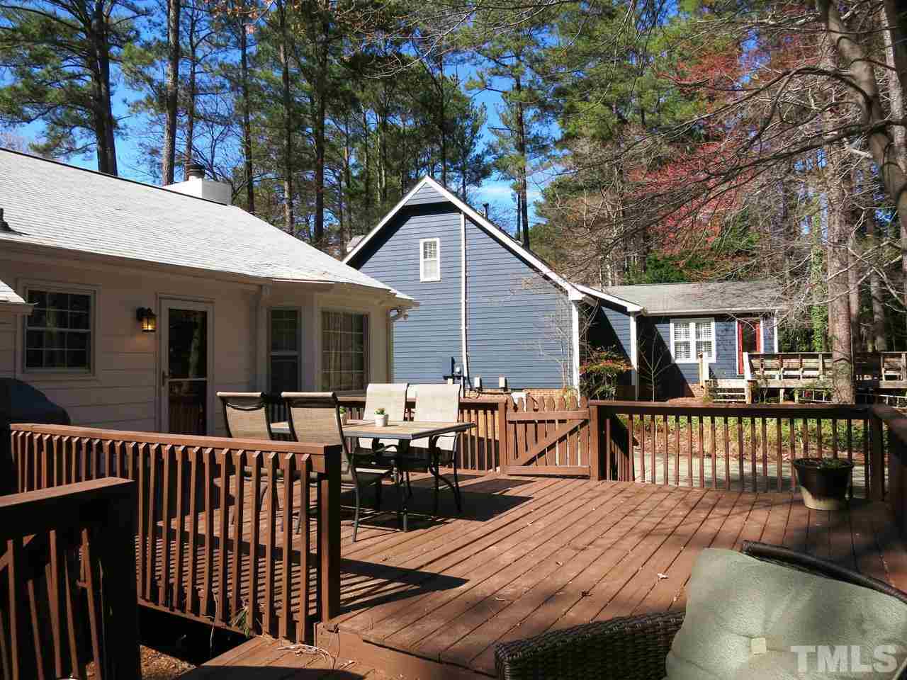 6408 Wynbrook Way Raleigh, NC 27612 - Photo 21 of 25 a view of a house with wooden deck and furniture