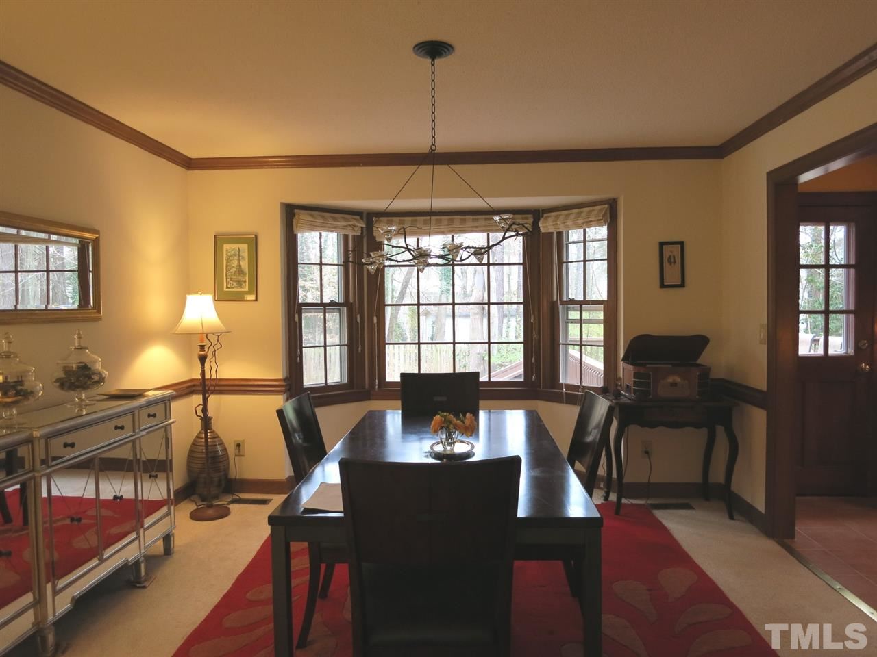 6408 Wynbrook Way Raleigh, NC 27612 - Photo 7 of 25 a living room with furniture and a window