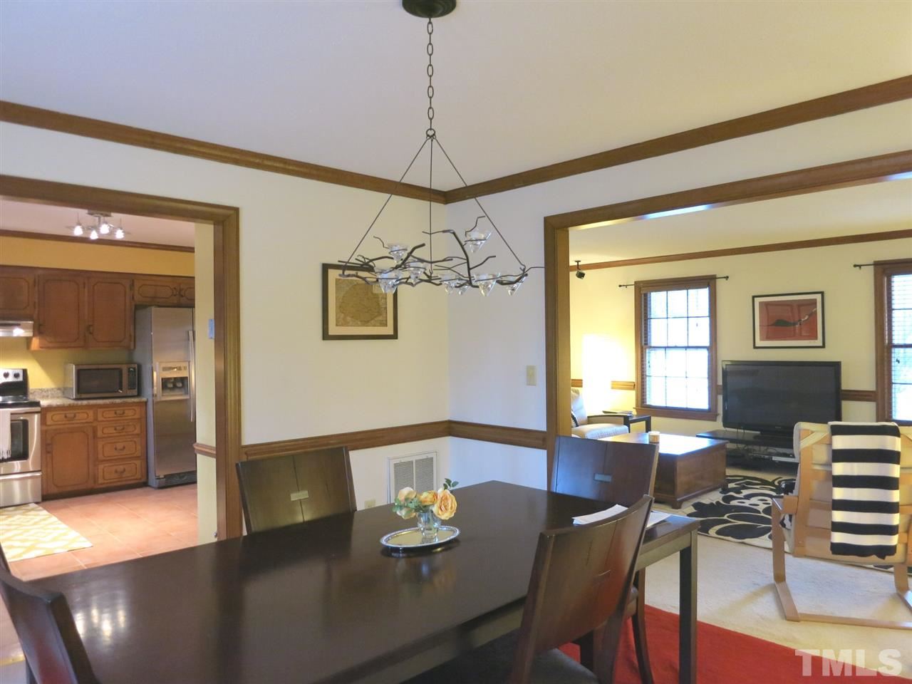 6408 Wynbrook Way Raleigh, NC 27612 - Photo 8 of 25 a view of a dining room with furniture