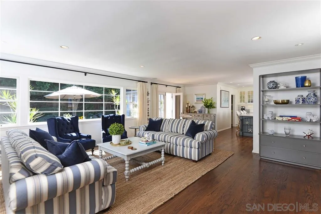 7865 El Paseo Grande La Jolla, CA 92037 - Photo 1 of 23 a living room with furniture and a large window