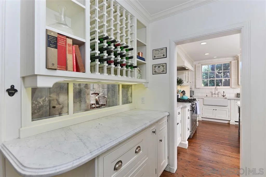 7865 El Paseo Grande La Jolla, CA 92037 - Photo 14 of 23 a bathroom with a sink a mirror and a toilet