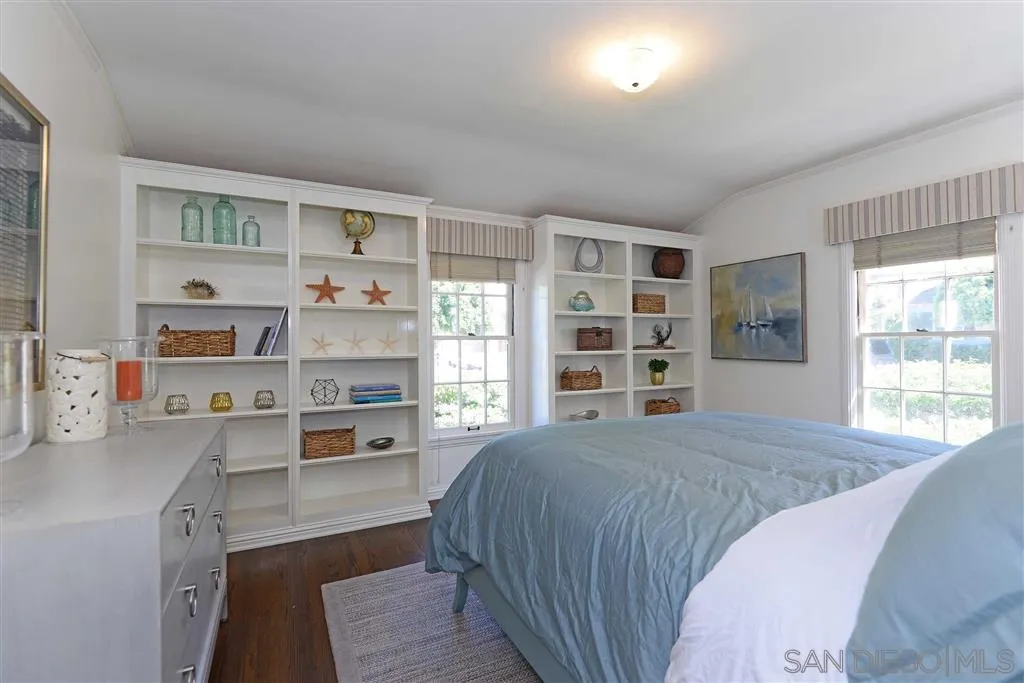 7865 El Paseo Grande La Jolla, CA 92037 - Photo 15 of 23 a bed room with a bed and a window