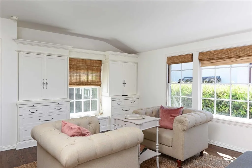 7865 El Paseo Grande La Jolla, CA 92037 - Photo 9 of 23 a living room with furniture and a large window