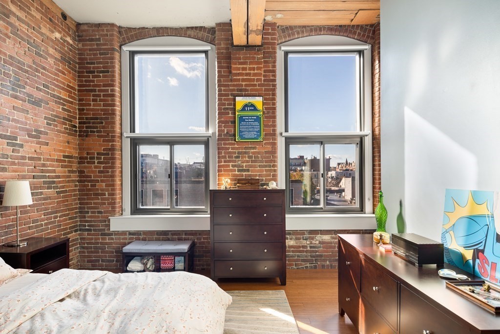 320 West 2nd Street, Unit 413 Boston, MA 02127 - Photo 12 of 20 a bedroom with a bed and wooden floor