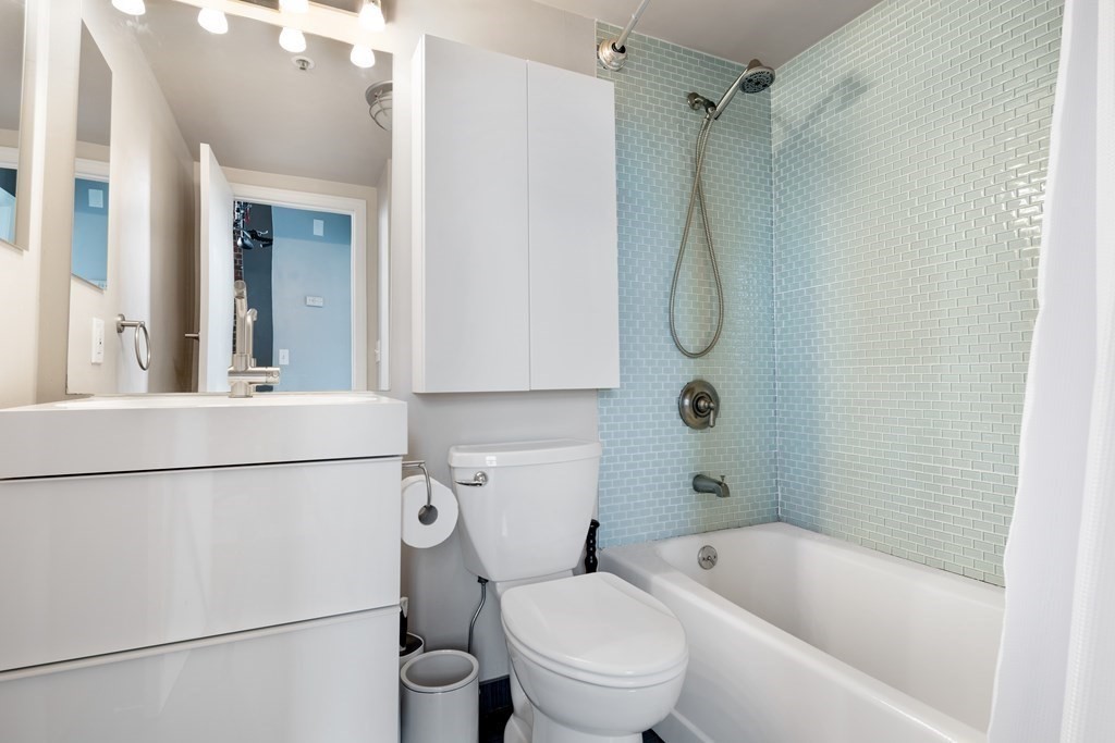 320 West 2nd Street, Unit 413 Boston, MA 02127 - Photo 14 of 20 a bathroom with a toilet sink and shower