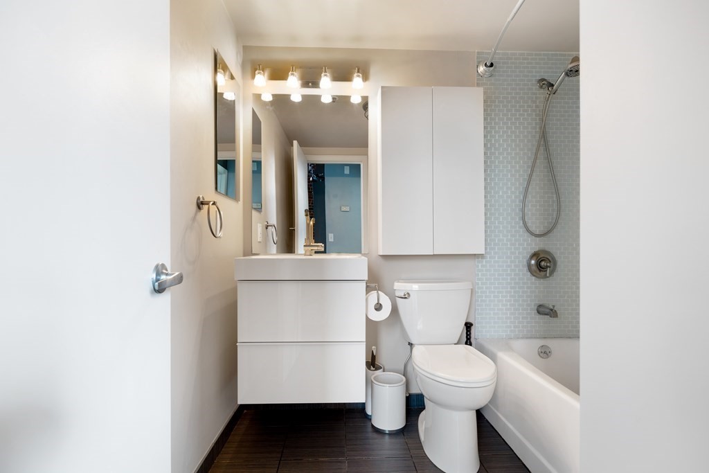 320 West 2nd Street, Unit 413 Boston, MA 02127 - Photo 15 of 20 a bathroom with a toilet sink and shower