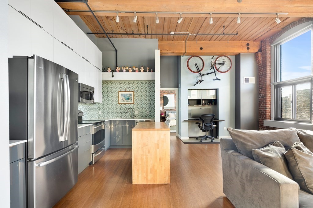 320 West 2nd Street, Unit 413 Boston, MA 02127 - Photo 2 of 20 a kitchen with stainless steel appliances granite countertop a refrigerator and microwave