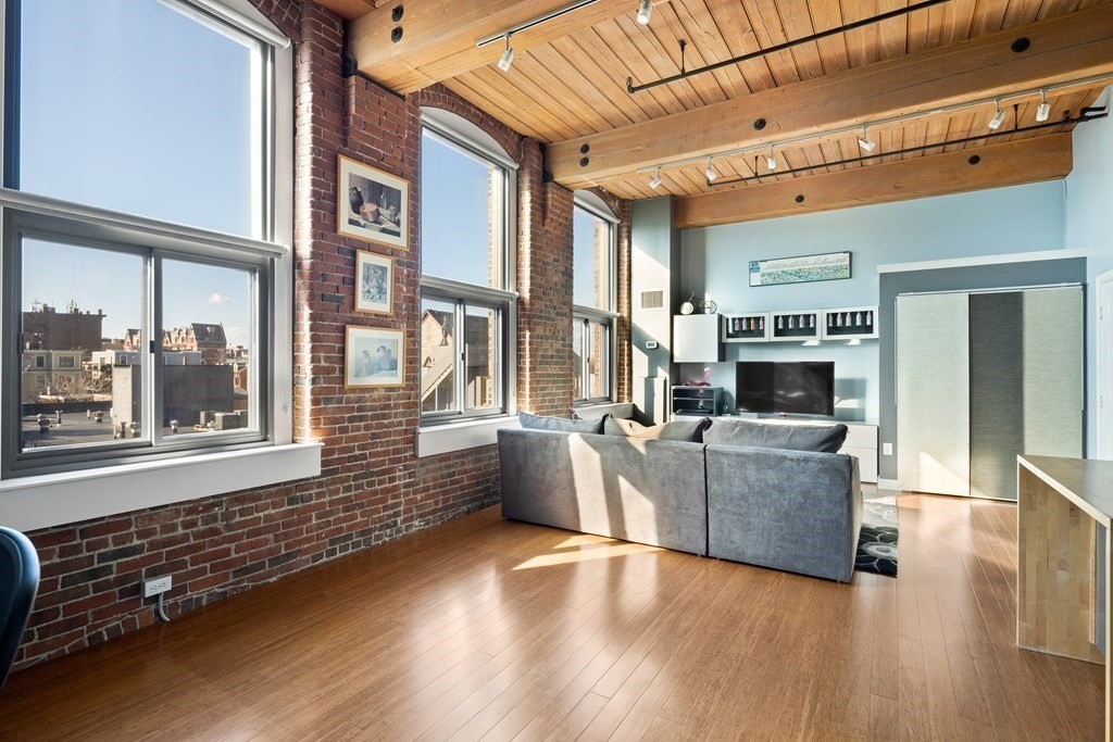 320 West 2nd Street, Unit 413 Boston, MA 02127 - Photo 5 of 20 a living room with furniture and a flat screen tv