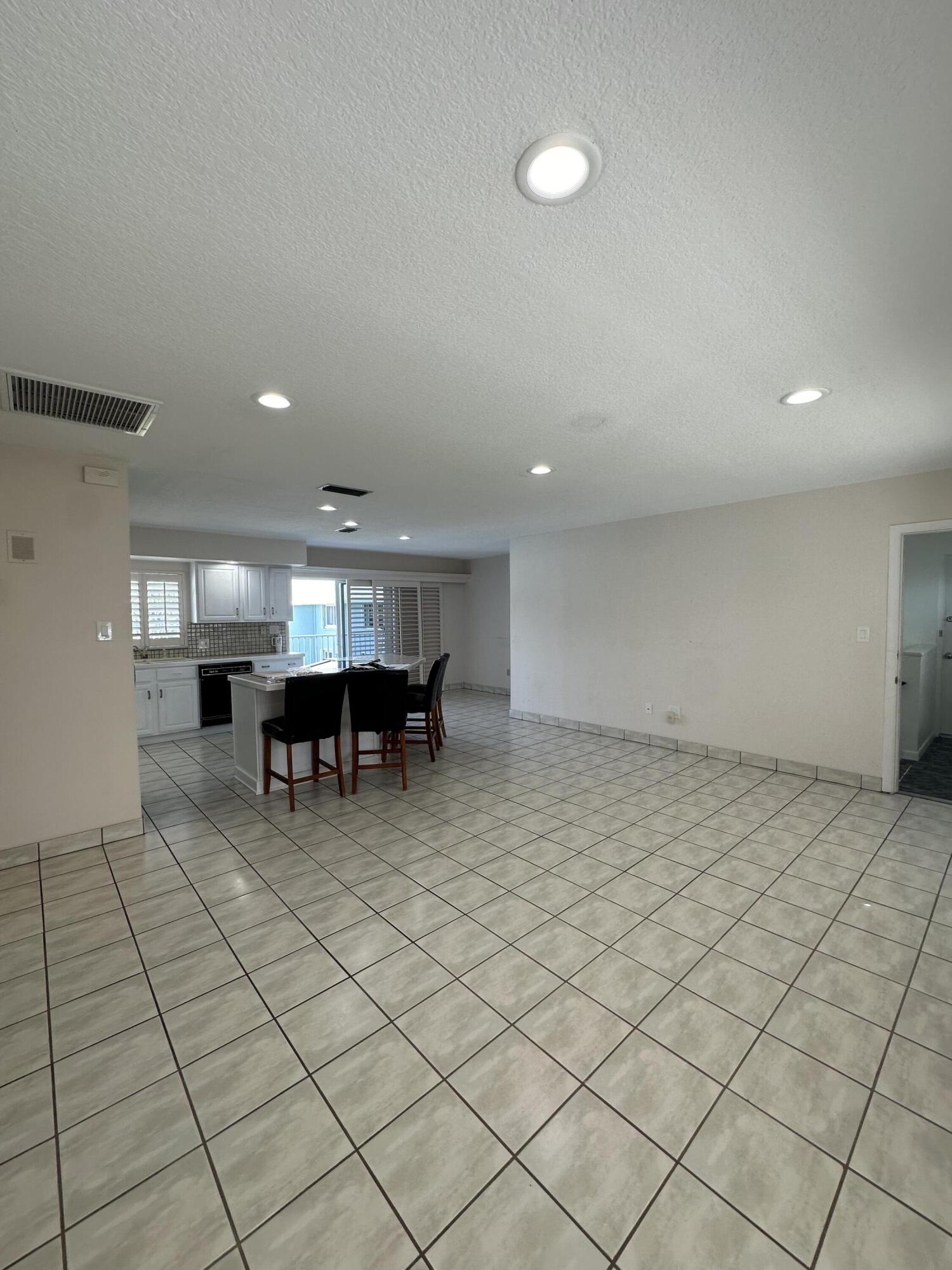 40 High Point Road, Unit D202 Tavernier, FL 33070 - Photo 17 of 28 an outdoor space with lots of furniture and white walls