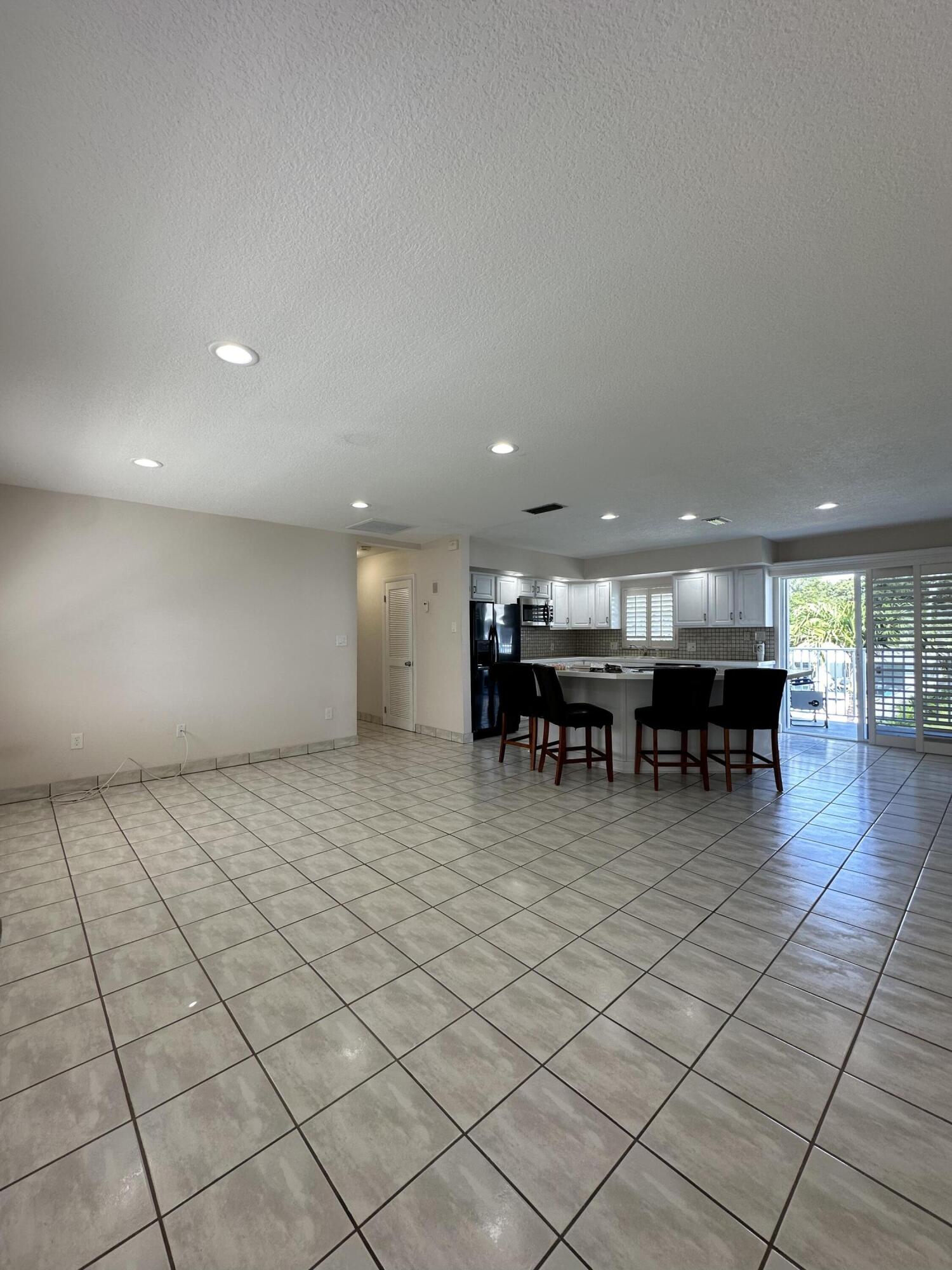 40 High Point Road, Unit D202 Tavernier, FL 33070 - Photo 18 of 28 a room with lots of furniture and a large window