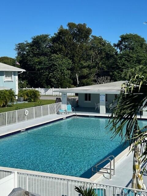 40 High Point Road, Unit D202 Tavernier, FL 33070 - Photo 28 of 28 a view of house with backyard outdoor seating and hardwood